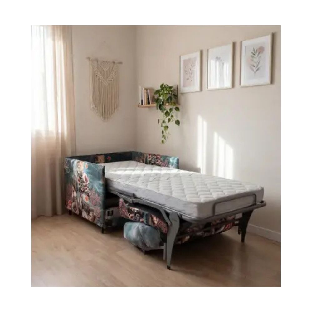 Sofa bed in a room with decor elements