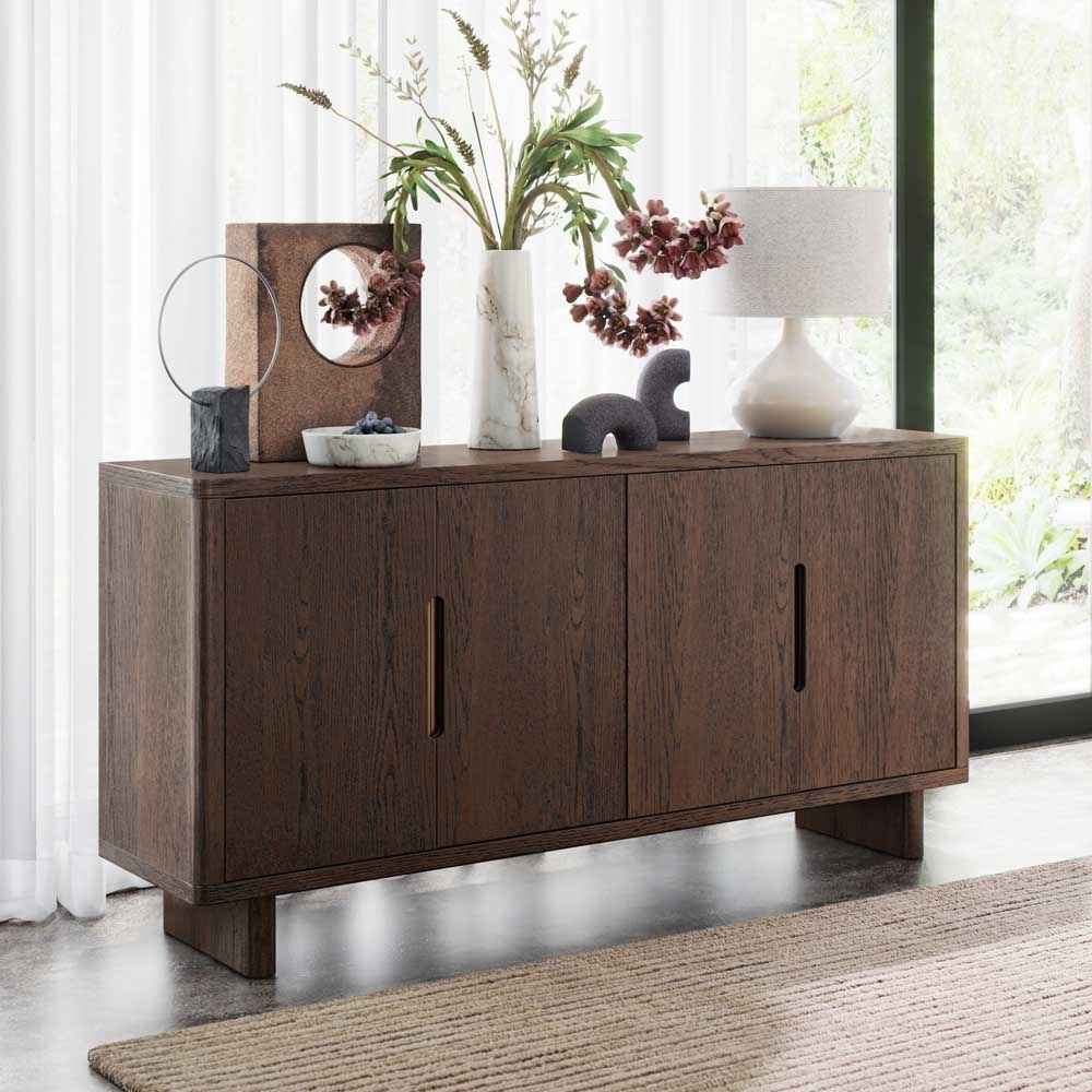 Wooden sideboard with decorative items in a bright room