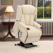 Beige lift chair in a home setting with a lamp and window in the background.