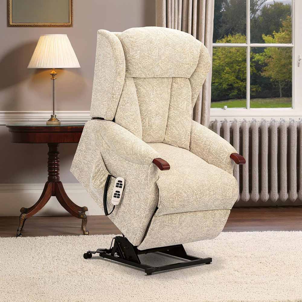 Beige lift chair in a home setting with a lamp and window in the background.