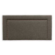 Black upholstered headboard with a studded metal design on a white background