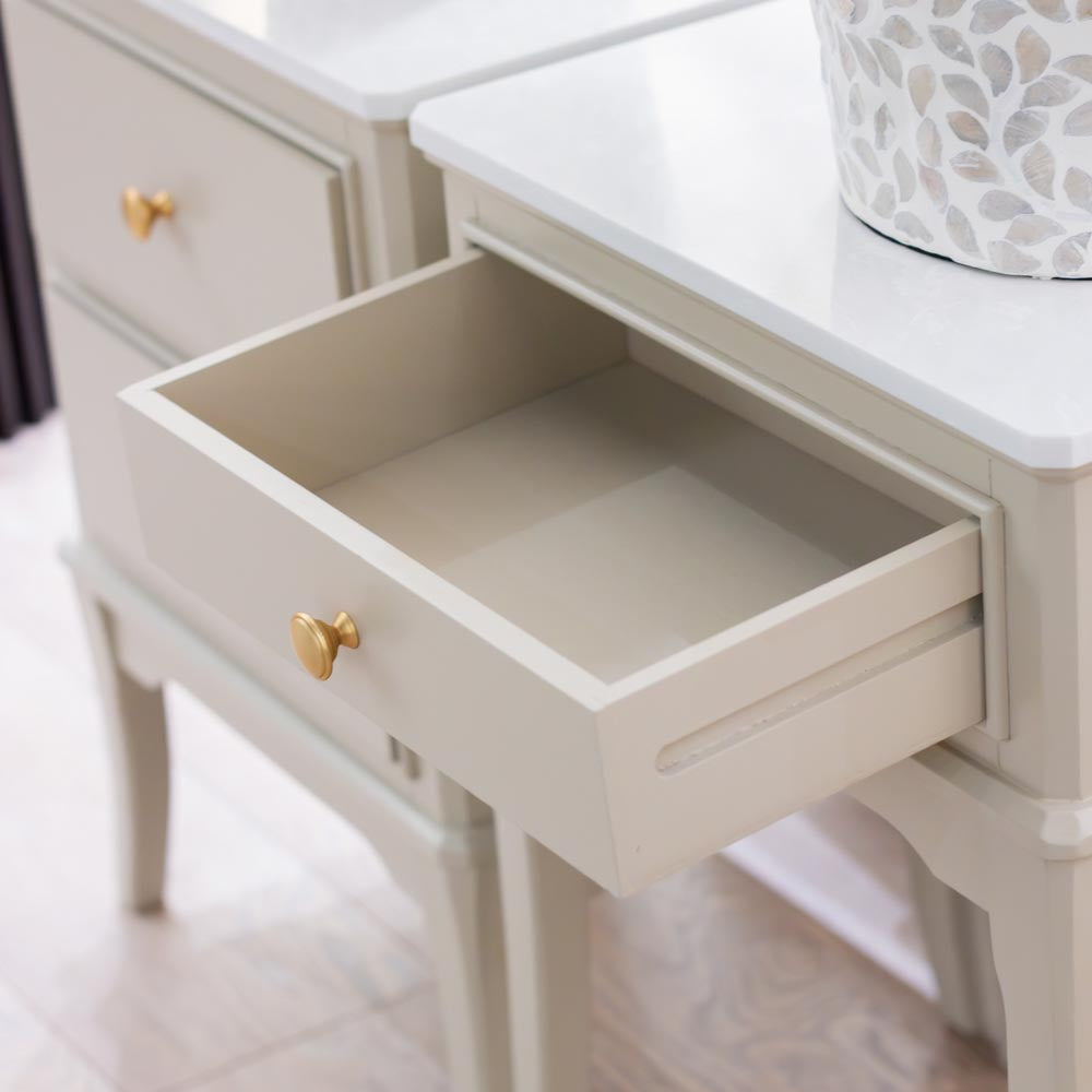 Close up of Taupe / beige lamp / accent table with open drawer