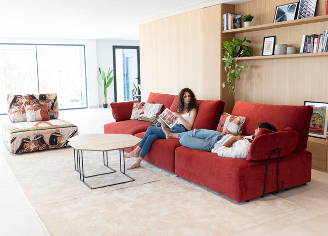 Large Red Teseo Model by Fama with 2 models. One lying down and one sitting