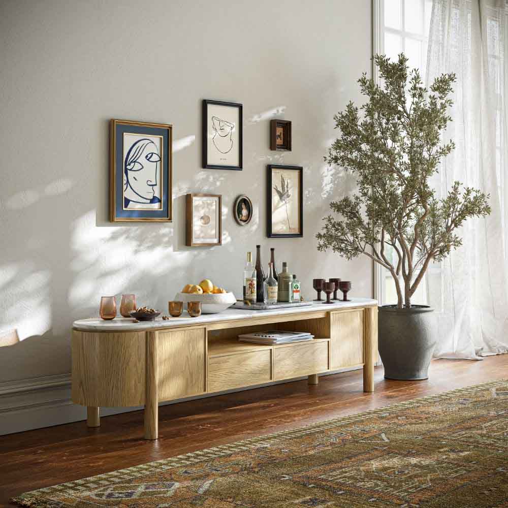Living room with light oak TV unit / entertainment centre, decorative items, and wall art.
