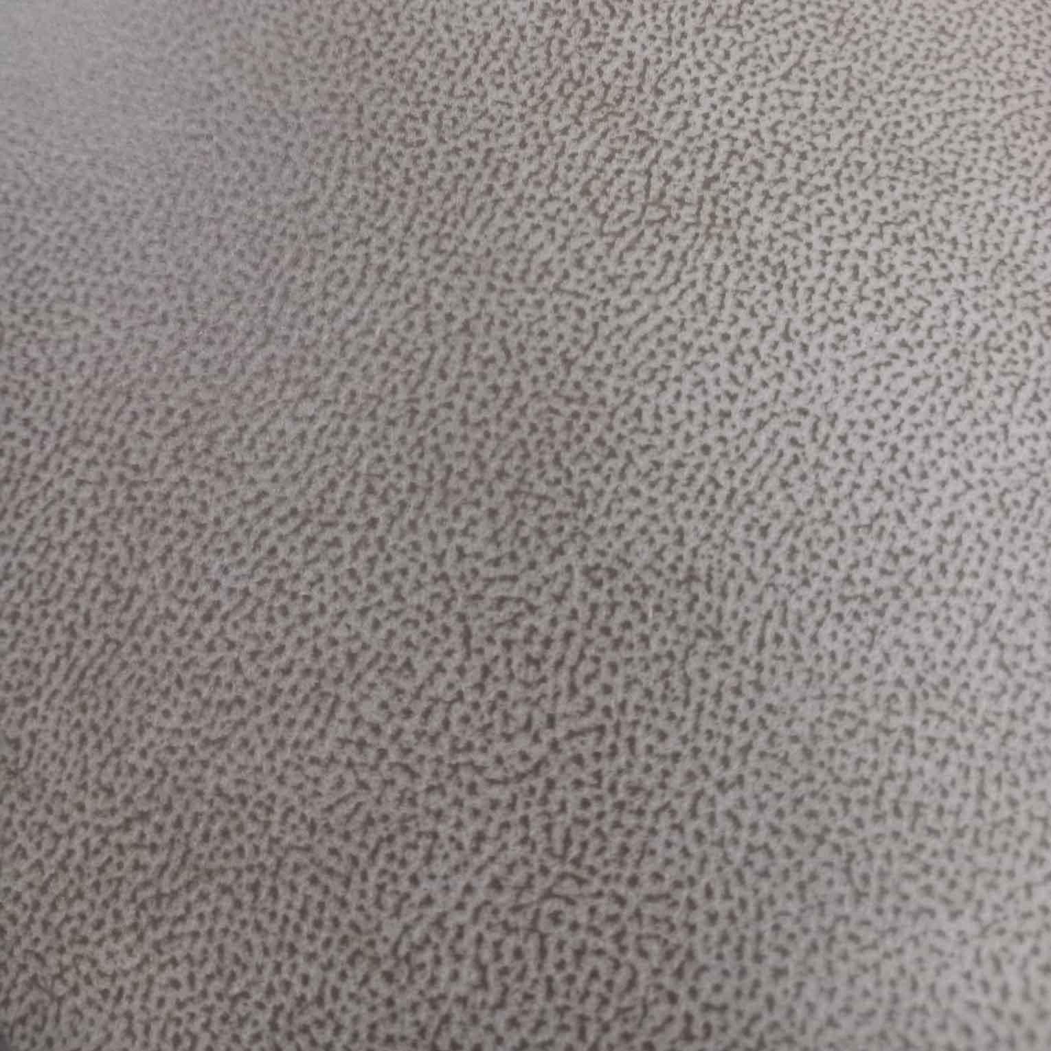 Close-up of a textured gray fabric surface