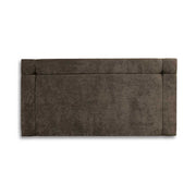 Charcoal upholstered headboard on a white background