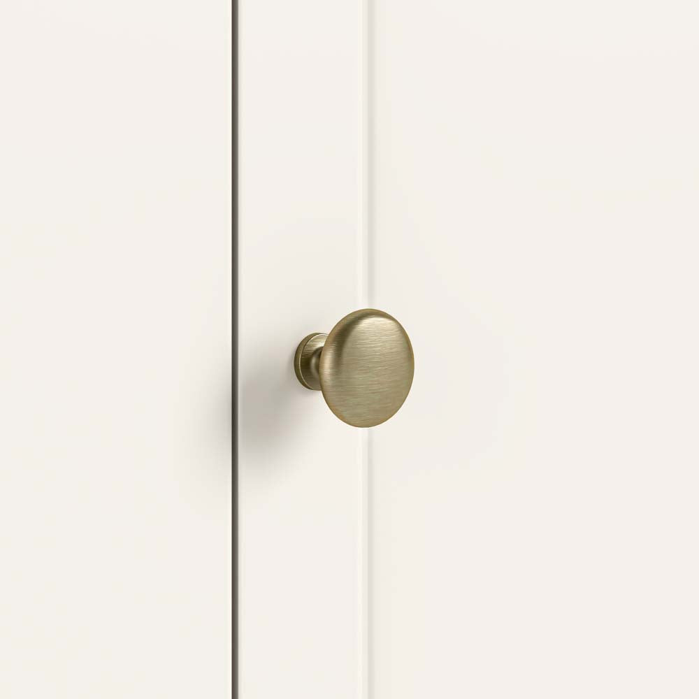 Gold knob handle on a white door