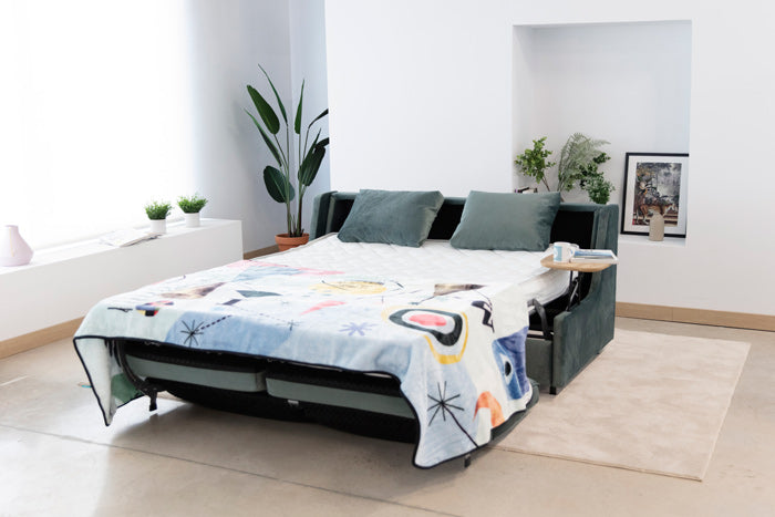 Apolo sofa bed reclined out with Table top arms and Throw