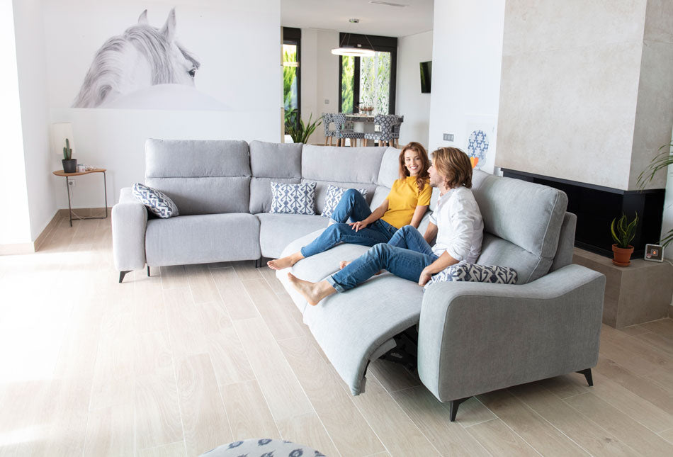 Large Modular Corner Sofa with electric recliners bring used by models