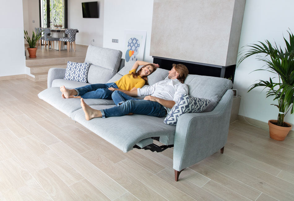 Axel LArge Sofa with Motorised Recliners being used by Models
