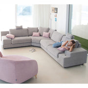 Large Calessi Corner Sofa with Model. Note the adjustable headrests and extra large arms