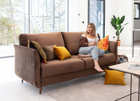Helsinki Sofa by Fama in its everyday form as a stylish sofa. Photo take in room setting with model