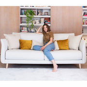 Helsinki 4 Seater Sofa in light fabric with model