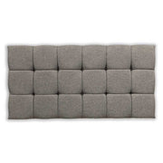 Silver tufted headboard on a white background