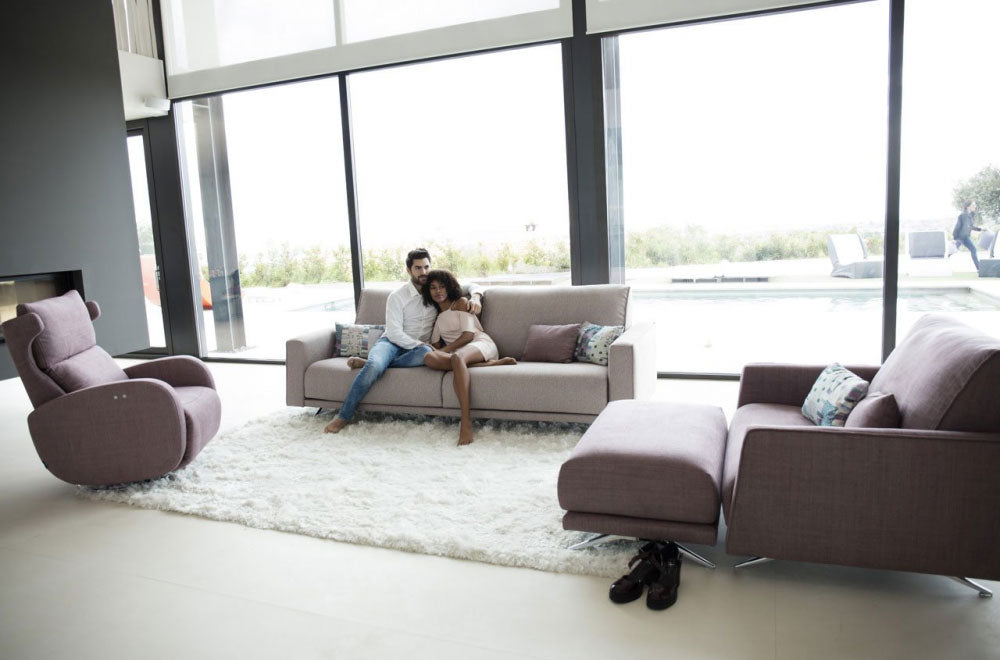 Boston sofa with models next to Boston Loveseat with footstool