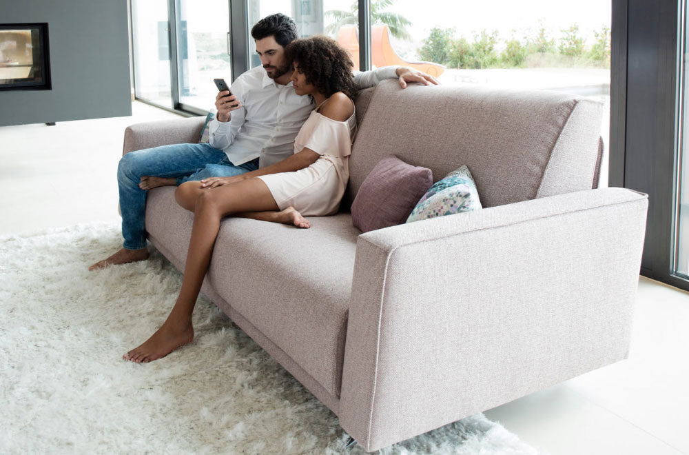 Close up of Arm on Boston sofa with 2 models sitting down