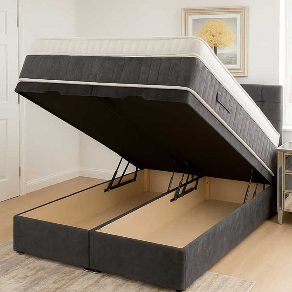 Gray upholstered ottoman bed with raised mattress in a room setting.