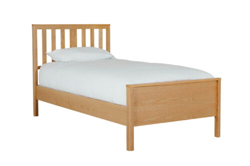 oak bedframe with white bedding for demonstration purposes